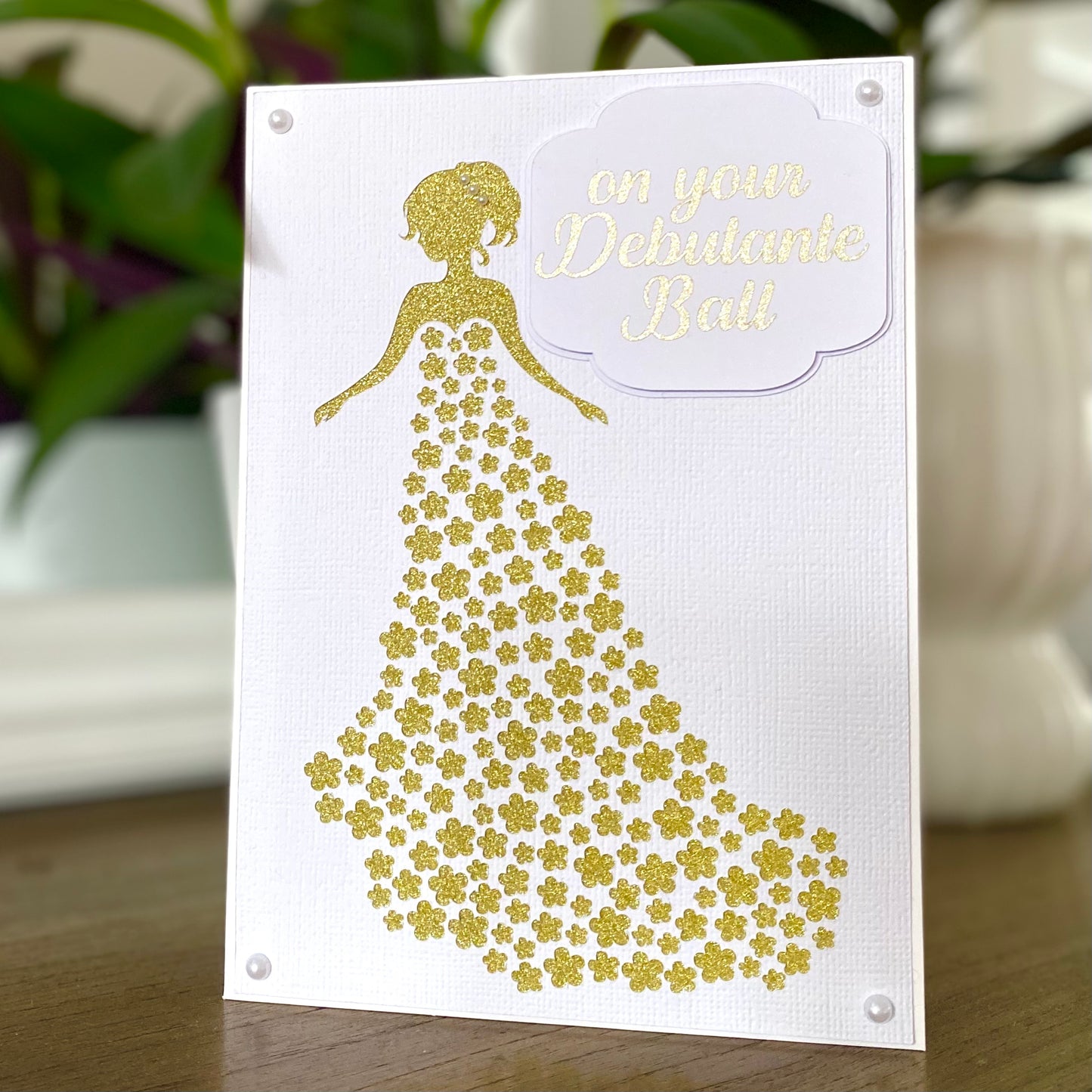 On your debutante ball, gold white debutante dress card.