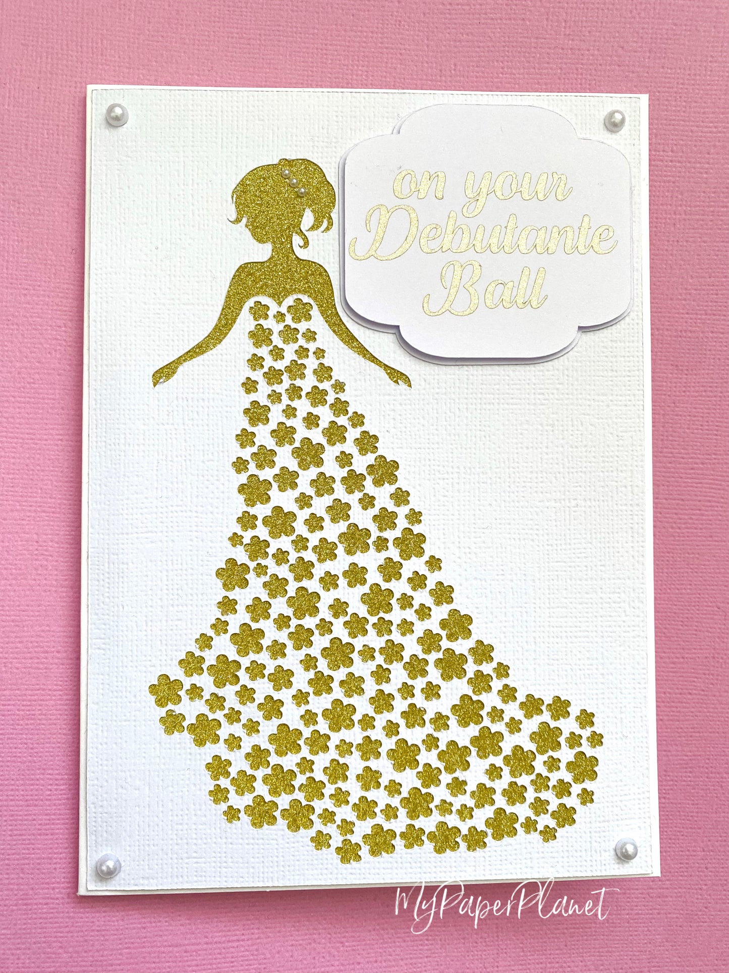 On your debutante ball, gold white debutante dress card.