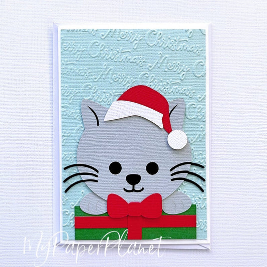 Christmas Cat with Gift greeting card. Santa kitty card.